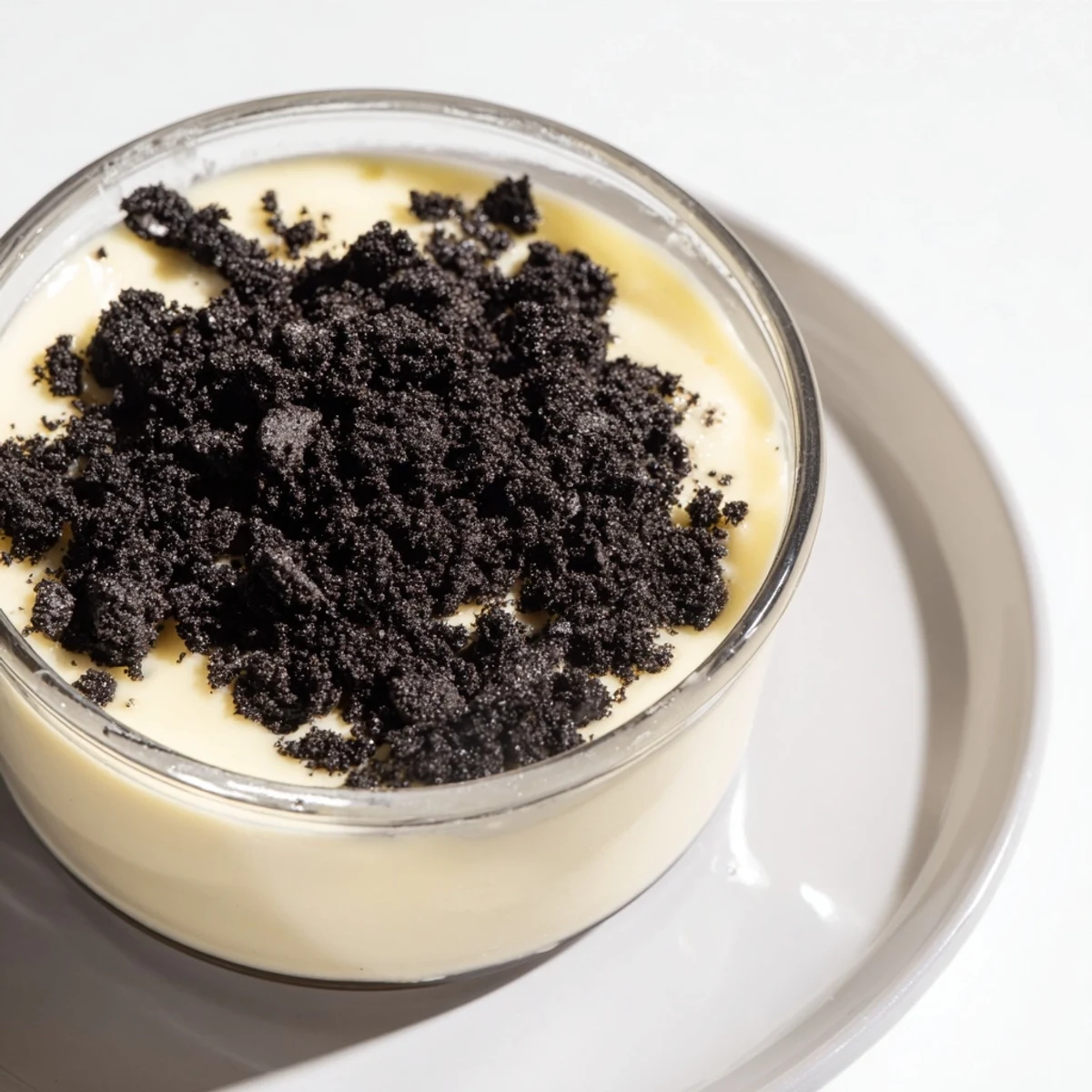 A close-up of creamy vanilla pudding with crushed Oreos, a classic dessert favorite.