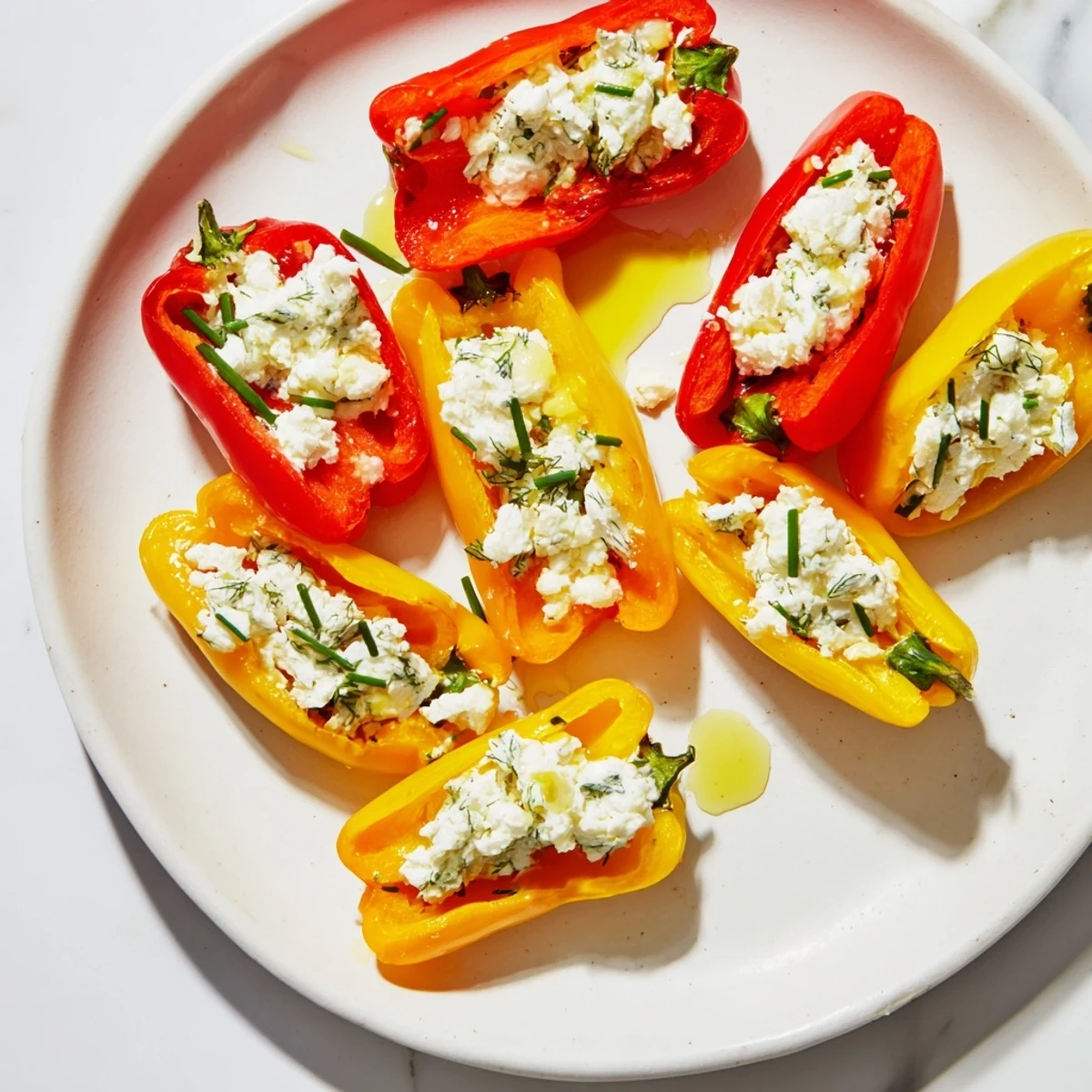Close-up of appetizer: Stuffed mini bell peppers with feta filling, ready to serve and enjoy.