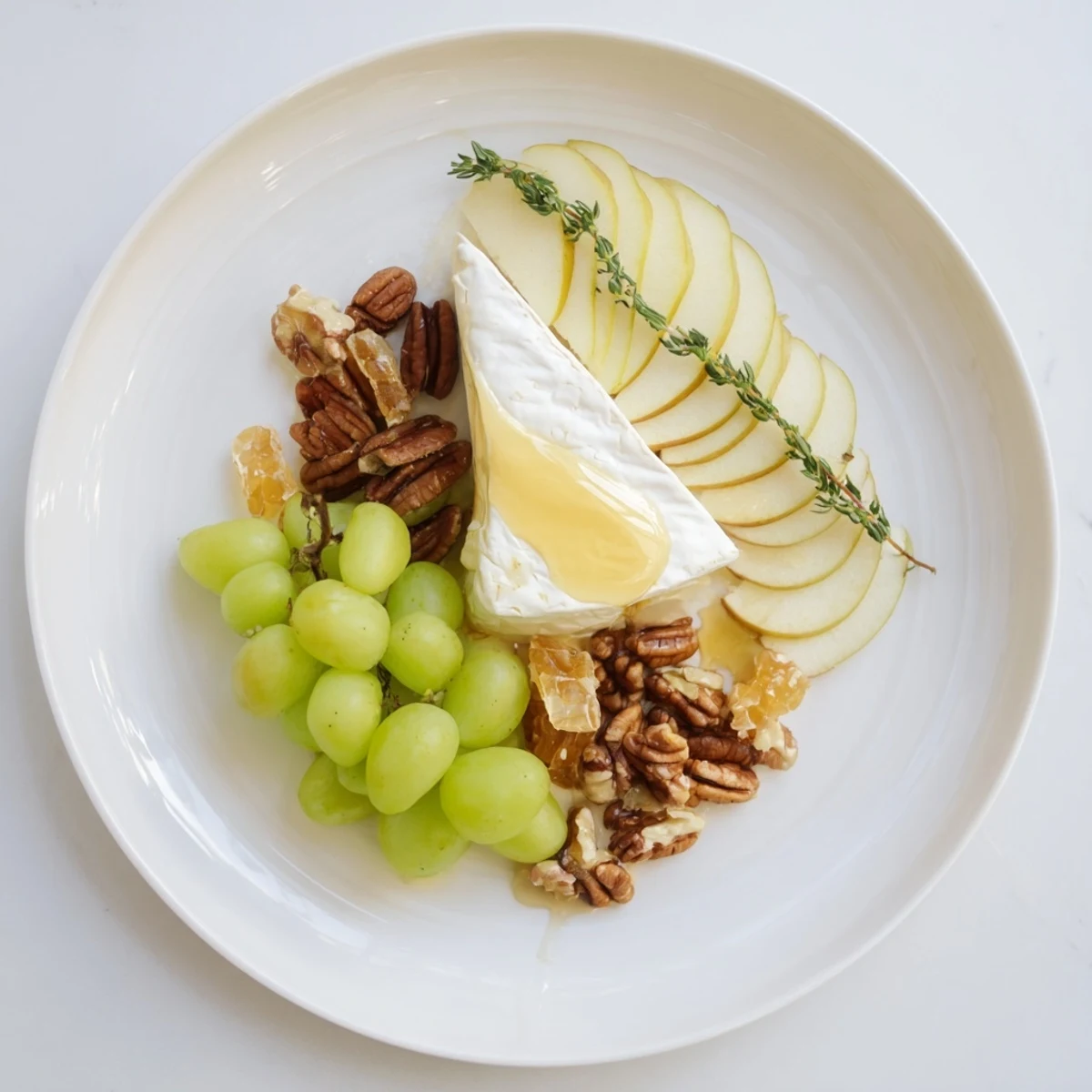 A visually stunning Winter Solstice Board offers a balance of savory cheeses, fruits, and nuts.