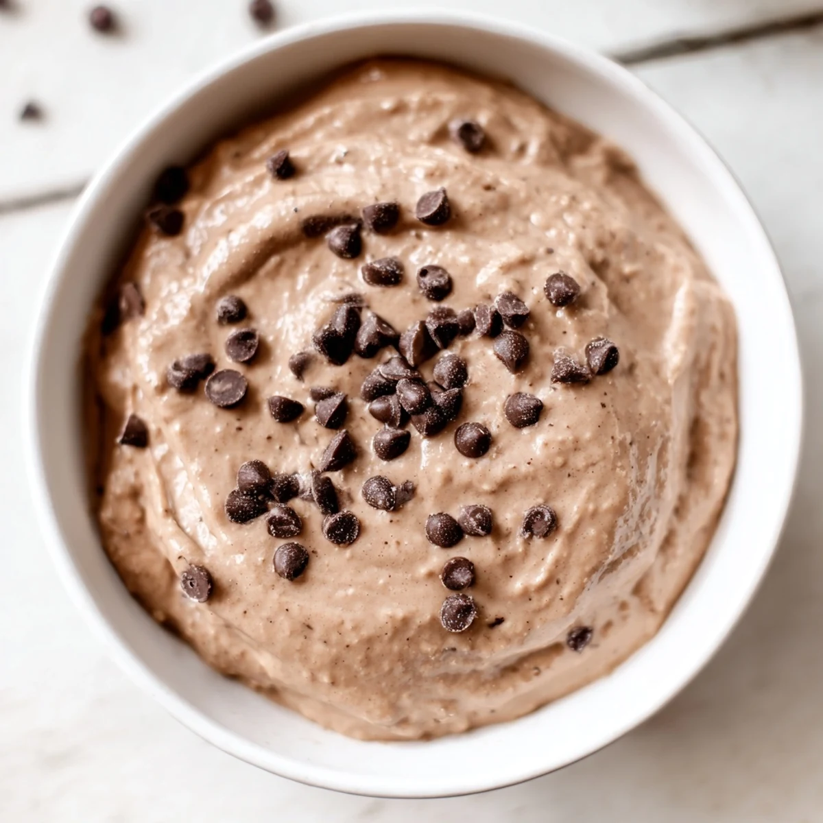 A close-up of decadent, rich Brownie Batter Dip, ready to be enjoyed with fresh fruit.