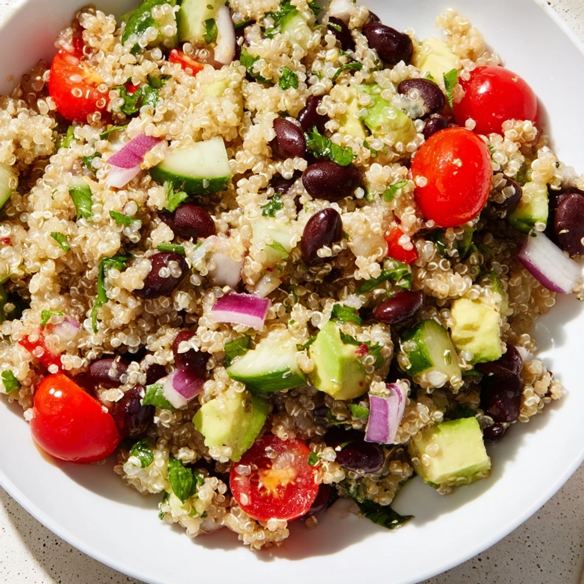 Chilled Quinoa Black Bean Salad, bursting with fresh veggies and a zesty lime dressing.