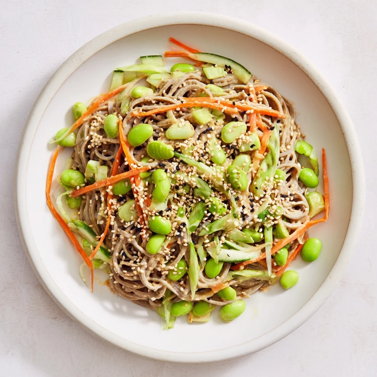Close-up of vibrant Asian Sesame Noodle Salad showcasing perfectly coated noodles, ready for a delightful bite.