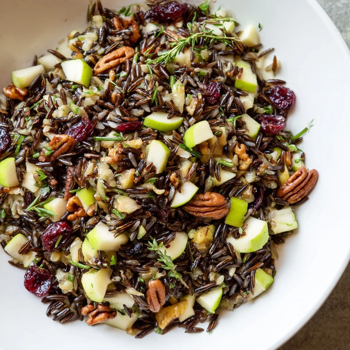 A close-up of the Wild Rice Harvest Salad with fresh herbs and zesty vinaigrette.