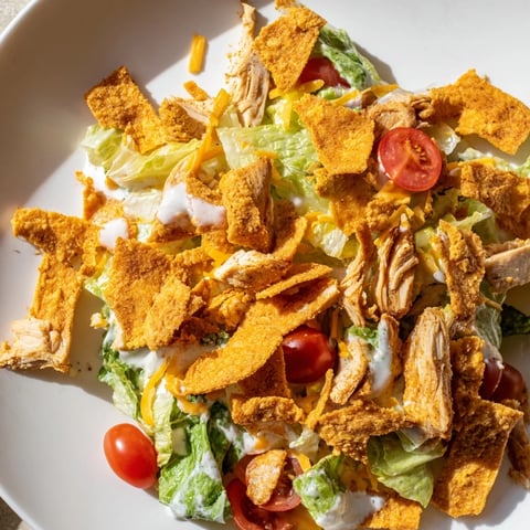 Crunchy Taco Chicken Salad features seasoned chicken, crisp romaine, black beans, and golden crushed taco shells for a vibrant Tex-Mex meal.