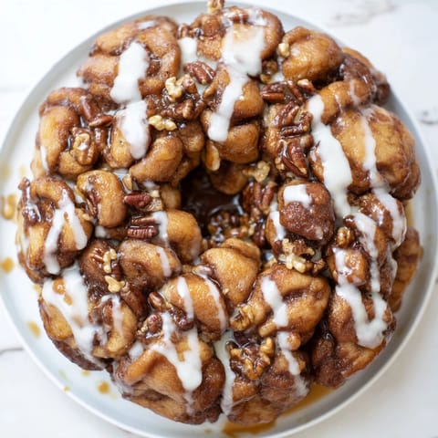 Warm, gooey Cinnamon Roll Monkey Bread, perfect for sharing and a comforting weekend dessert.