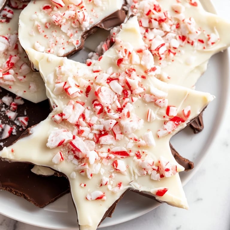 Shiny dark chocolate and creamy white chocolate layers make up these festive Peppermint Bark Snowflakes.