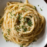 Golden strands of Miso Butter Pasta tossed in a rich, flavorful sauce, ready to be enjoyed.